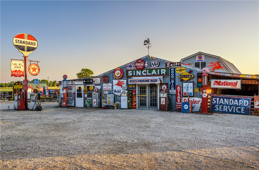 Vintage metal advertising signs at a gas station